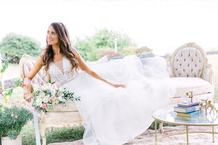 Bride poses on wedding day lounge for editorial wedding photography in New York