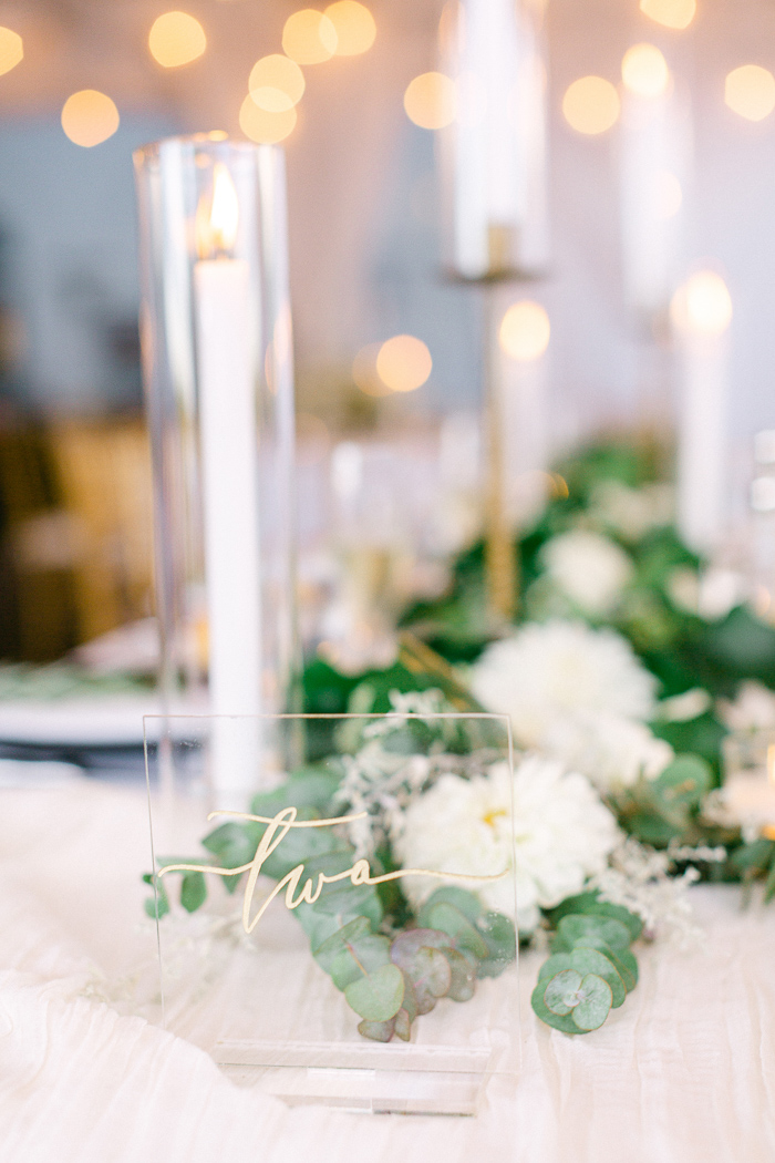 Wedding reception with stunning classic decor and white and greenery wedding color palette