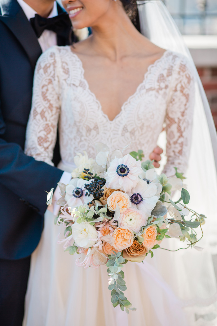 wedding bouquet closeup during bride and groom photos