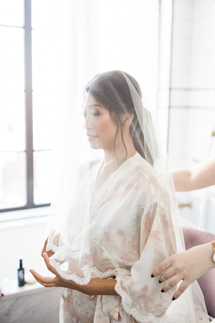 bride gets ready with veil in New York City