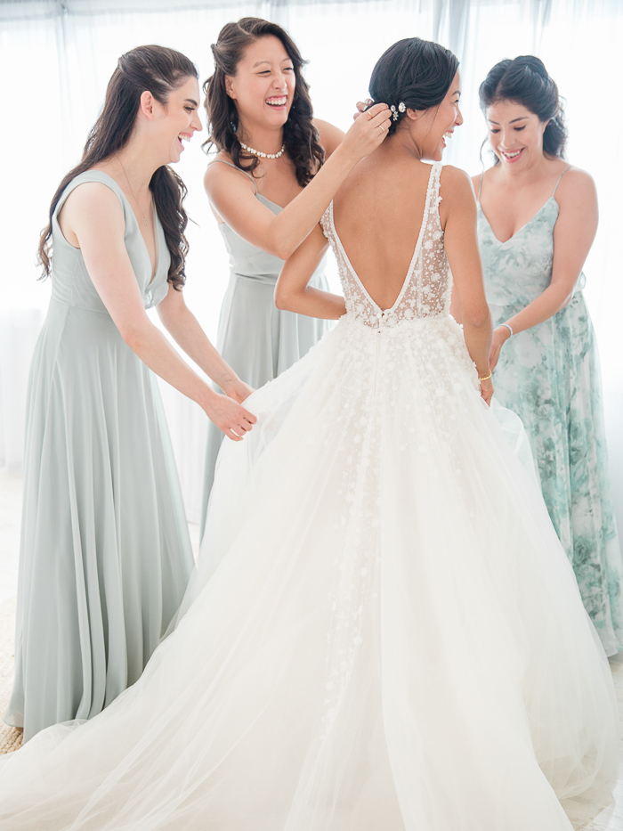 Beautiful bride getting ready with bridesmaids