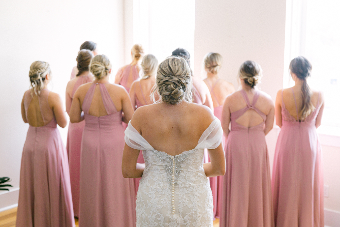 brides reveal with bridesmaids