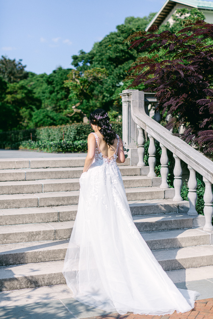 Bride heading to her first look location at Brooklyn Botanical Gardens