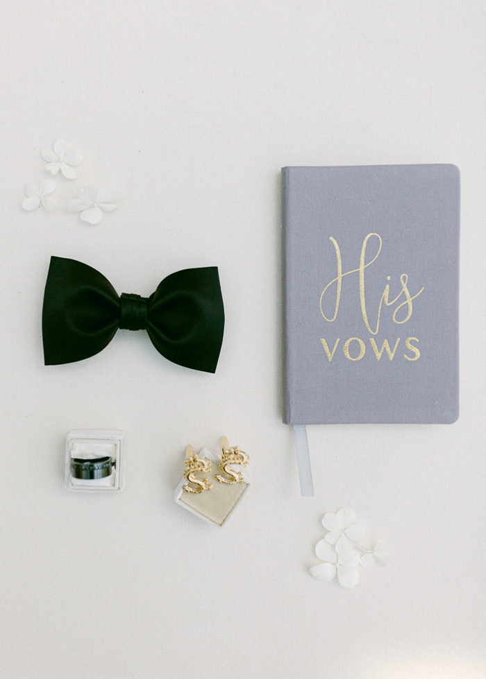 customized vow book, groom bow tie and snake cuff links