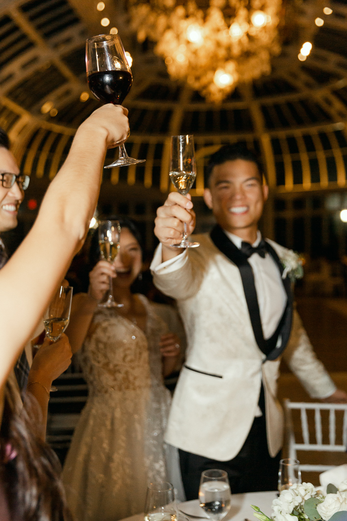 NYC wedding photos of champagne toast 