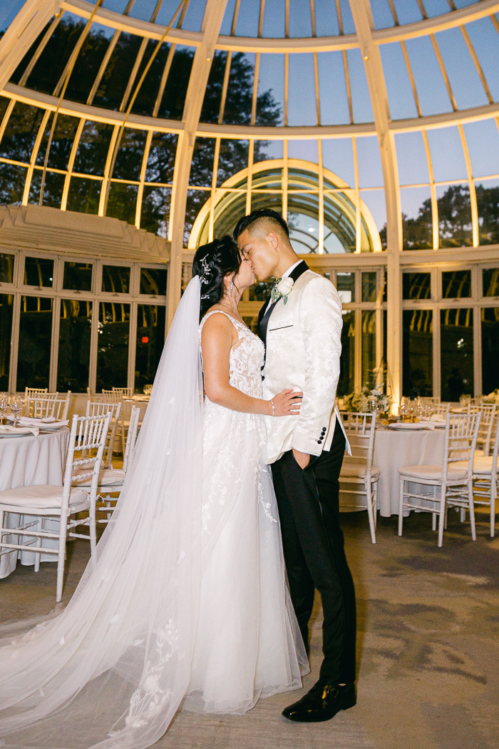 Stunning wedding reception setup at Brooklyn Botanical Gardens (white, greenery, gold)
