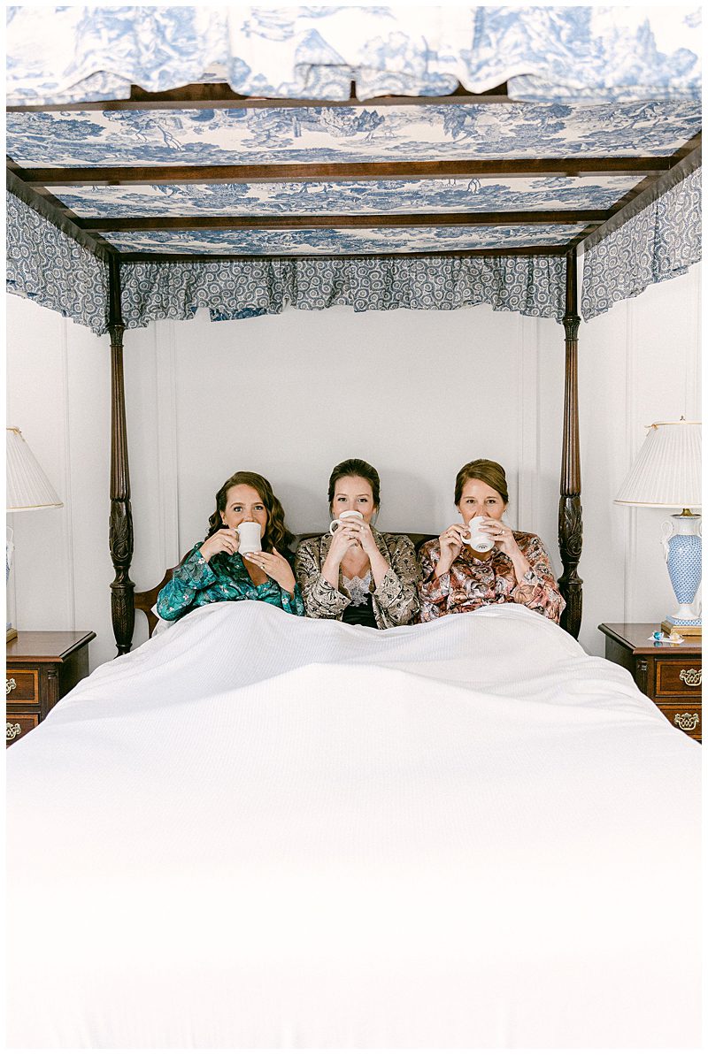 BRIDE WITH MOTHER AND SISTER IN BED SIPPING COFFEE