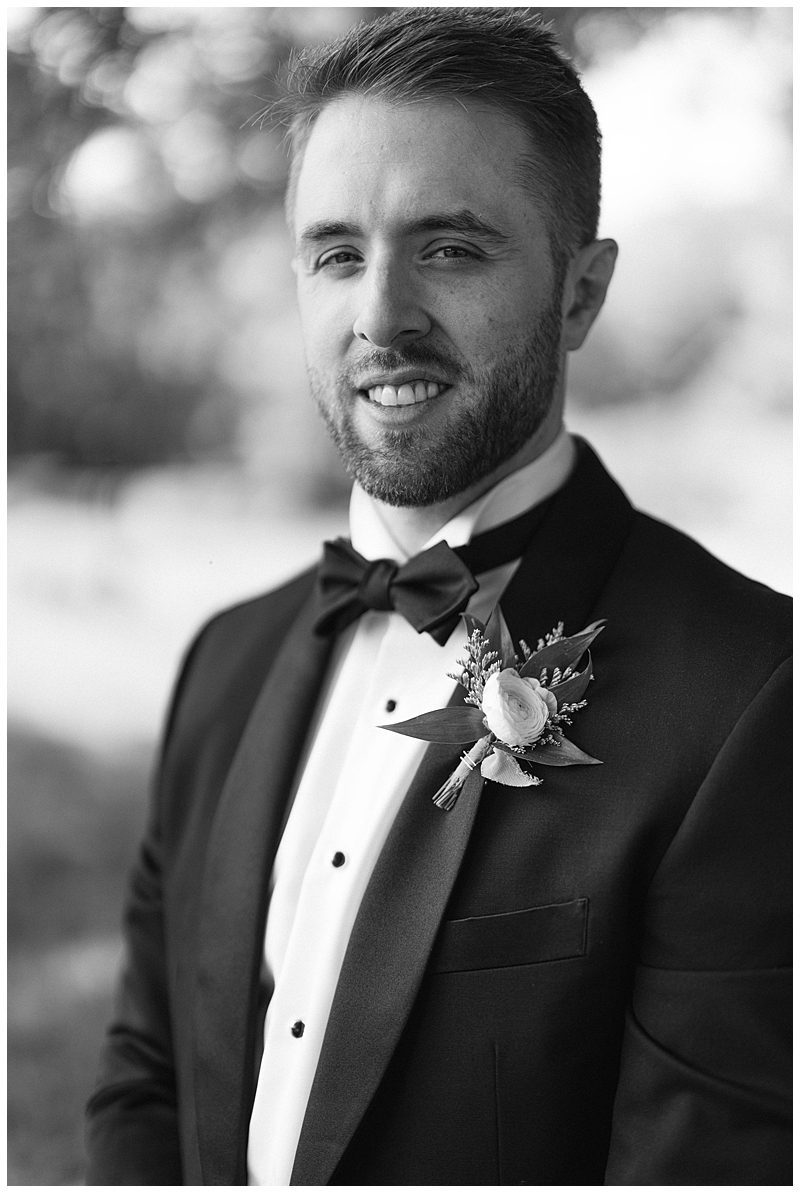 BLACK AND WHITE CLOSE UP OF GROOM