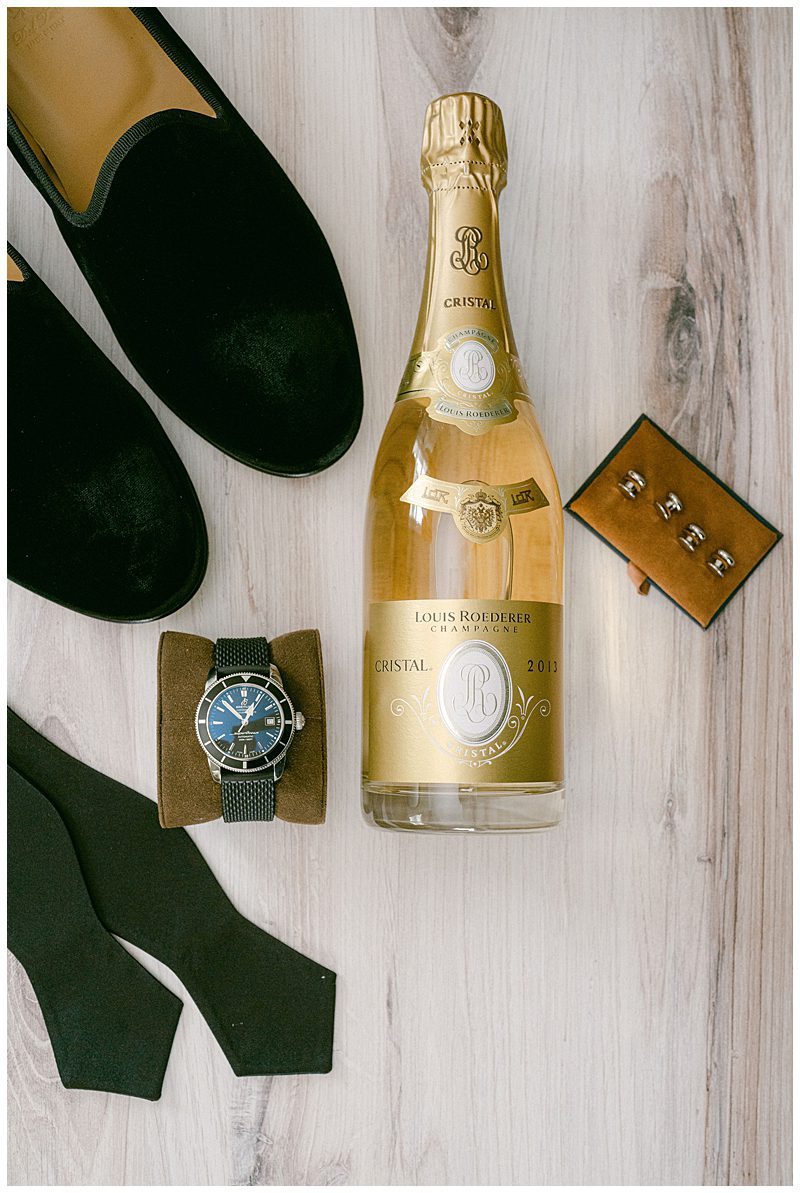 GROOM WEDDING ACCESSORIES AND A BOTTLE OF CRISTAL