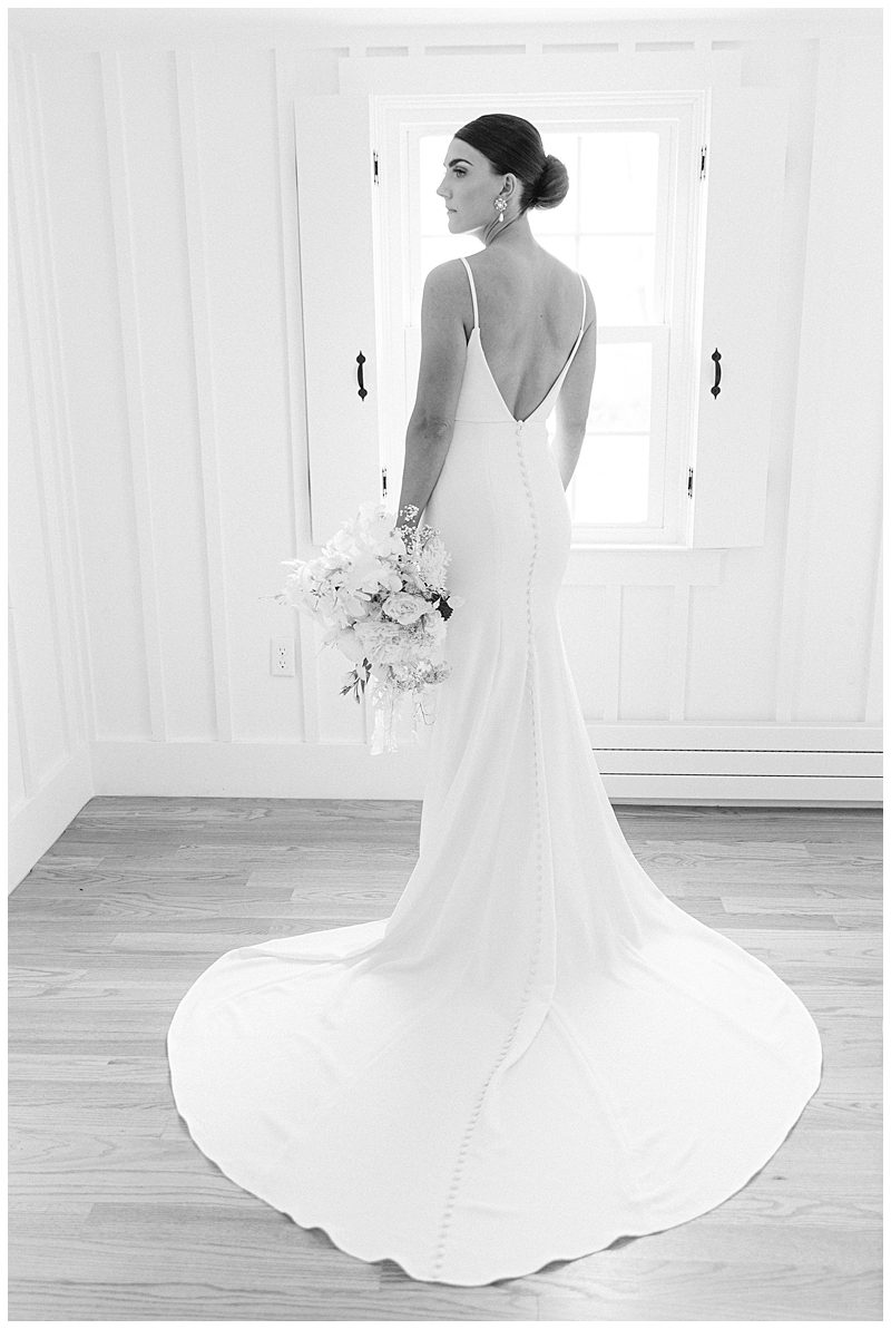 BLACK AND WHITE PHOTO OF BRIDE IN WEDDING DRESS