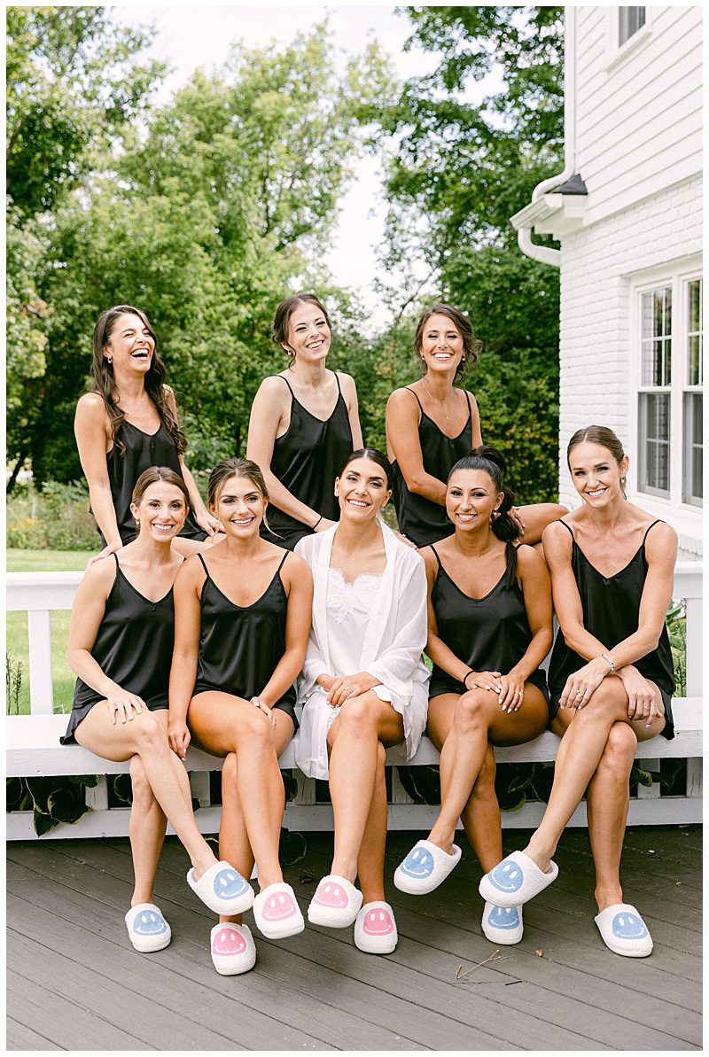 BRIDE WITH BRIDESMAIDS OUTSIDE 