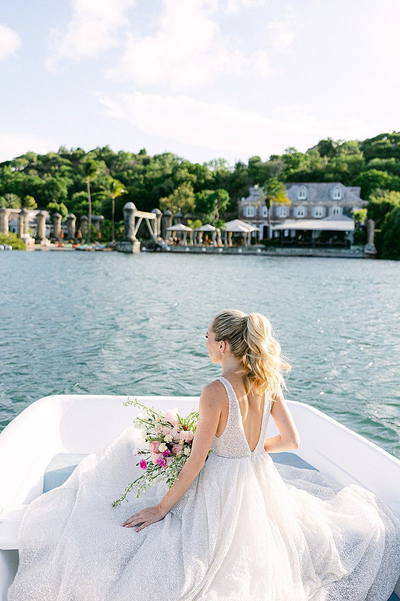BRIDE ARRIVING AT THE CEREMONY BY BOAT