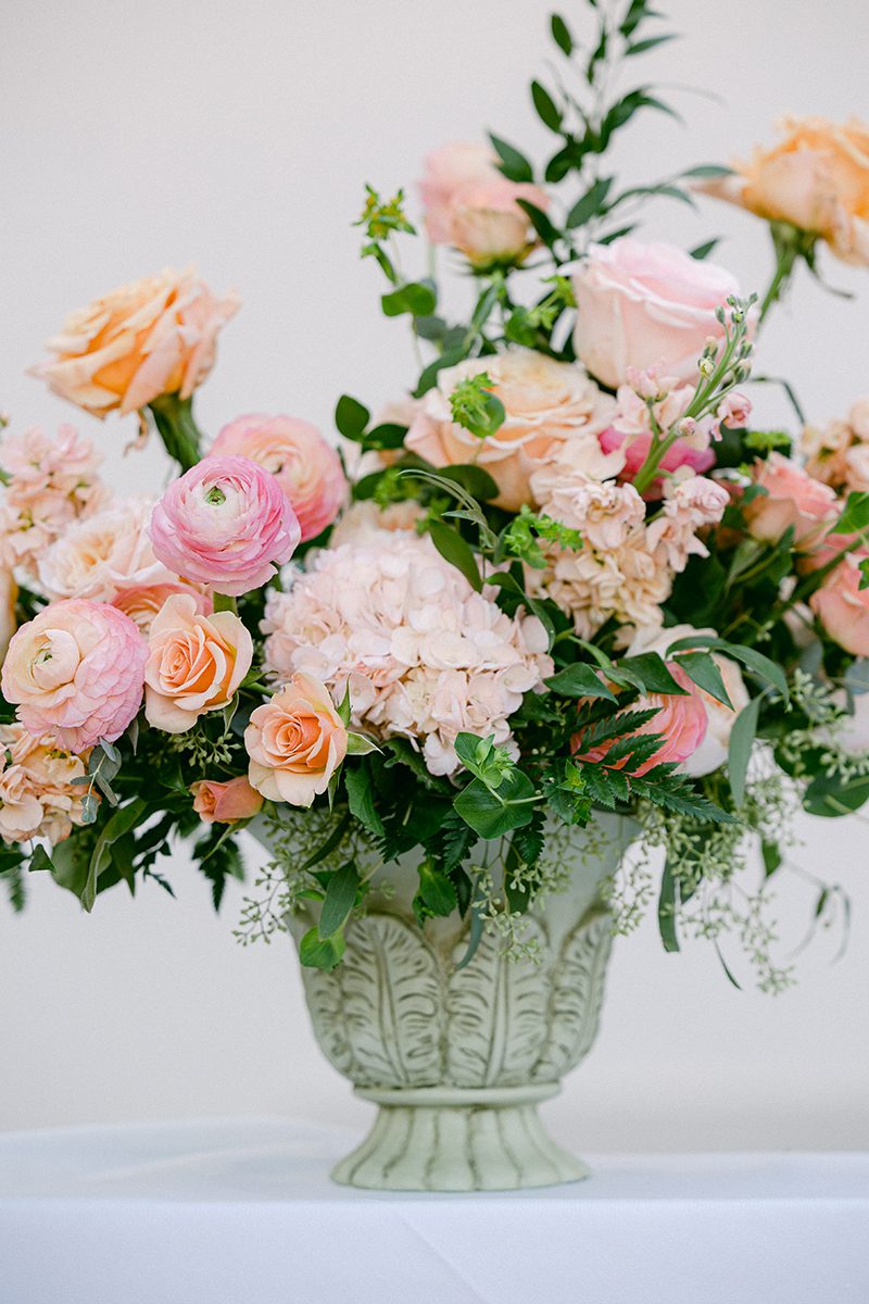 CLOSE UP OF PINK AND BLUSH FLORAL ARRANGEMENT 